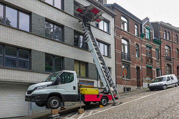Furniture lift truck on cobblestone street