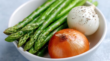 Bowl of asparad and onions bowl filled with asparad and onions presenting simple culinary ingredients
