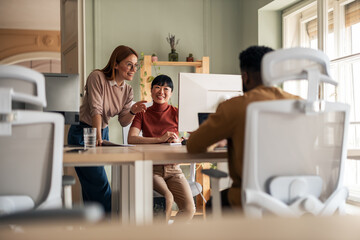 Diverse Team Collaborating on Ideas in a Modern Office Workspace