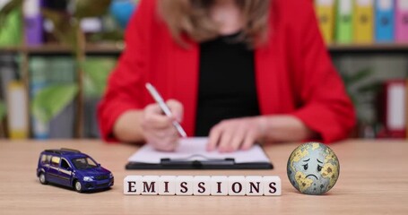 Exploring emissions and their impact on our planet through thoughtful discussion and analysis in a vibrant workspace