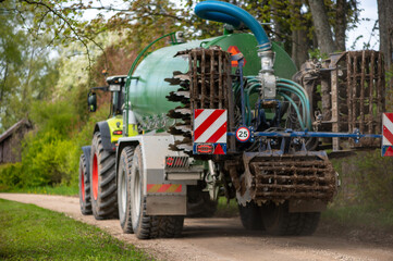 Massive agricultural machine on country road