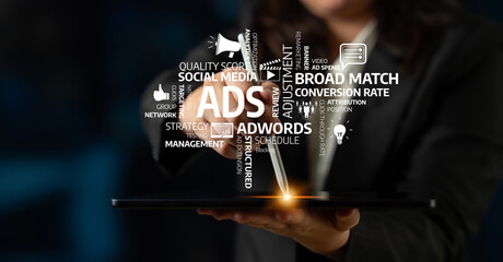 A professional interacts with a tablet displaying digital advertising concepts, showcasing keywords related to modern marketing strategies and performance metrics. Tessel
