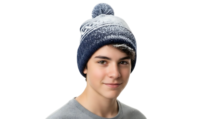 A teenager wearing a blue and white knit hat with a pom-pom smiles while looking at the camera isolated on a transparent background