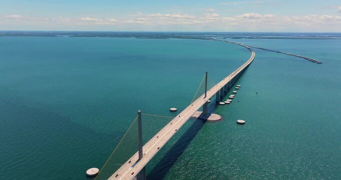 Highway road traffic driving over Sunshine Skyway Bridge in Florida. Transportation infrastructure in USA