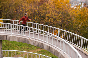 Man Running on Urban Circular Path in Autumn
