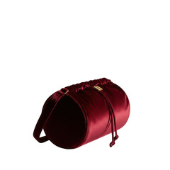 Red velvet cylindrical drawstring bag with gold hardware