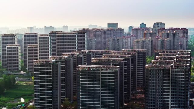 Aerial shot of dense high rise residential apartment buildings in large urban community.