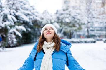 Young woman enjoying a snowy winter day