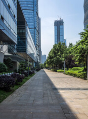 Fototapeta premium Captivating Urban Landscape with Towering Skyscrapers Amidst Lush Greenery