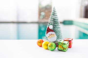 Santa Clause with Christmas tree and ornament over blurred background, Christmas card background idea