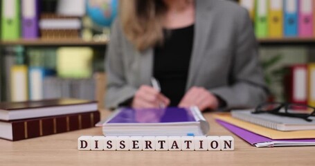 Focused student writing a dissertation in a bright, colorful library filled with books and resources during the afternoon