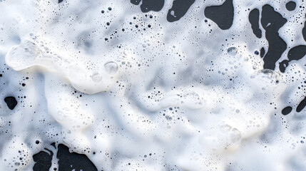 Foamy white bubbles create textured surface, resembling natural pattern. image captures essence of fluidity and freshness