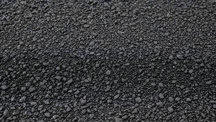Closeup texture of dark asphalt or coarse gravel surface background