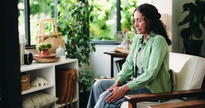 Knee pain, injury and fibromyalgia with woman on sofa for arthritis, joint emergency and inflammation. Osteoporosis, sprain crisis and accident with person in living room of home for legs tension