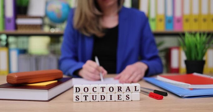 Engagement in academic pursuit with focus on doctoral studies at a tidy workspace