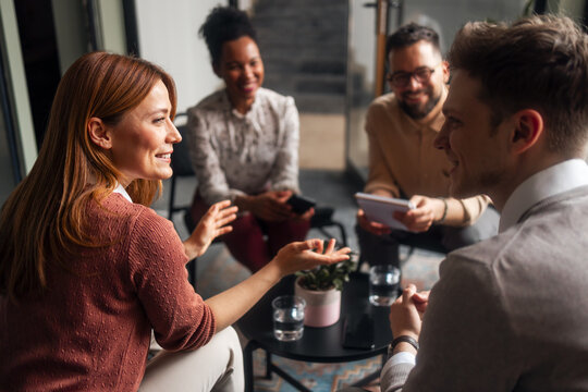 Friendly Group Discussion in Modern Office Space