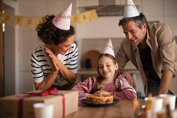 Joyful Family Celebrating a Young Girl's Birthday at Home