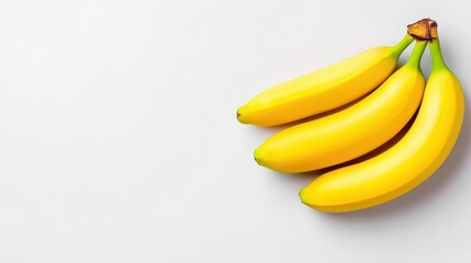 Fresh yellow bananas arranged on a clean white background, showcasing their vibrant color and smooth texture, ideal for healthy eating concepts and culinary uses
