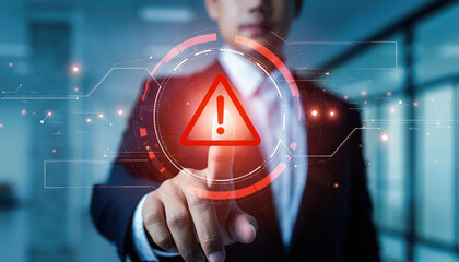 Businessman interacting with digital alert symbol, showcasing technology and communication in modern office environment. image conveys urgency and attention to detail