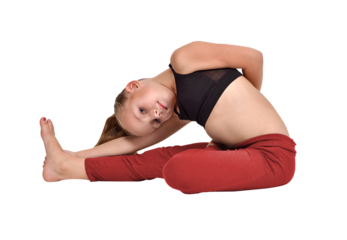 Girl in yoga pose wearing red leggings and black crop top