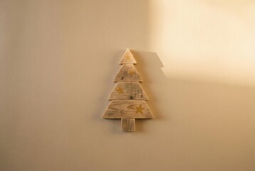 Wooden geometric Christmas tree in warm minimal decor
