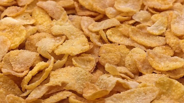 Corn flakes texture background, cornflake cereal, morning breakfast. Close-up