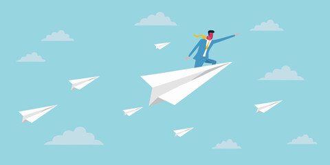 Business person flying on a paper airplane amidst fluffy white clouds