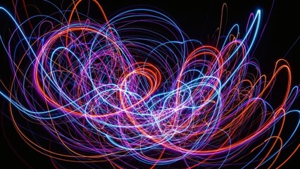 A vibrant and chaotic abstract image of swirling neon light trails in pink, blue, and orange against a black background. Created with long exposure, it represents energy and motion.