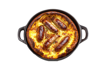 top view of traditional English toad in the hole with sausages and cheese, in a cast iron pan, isolated on a white background
