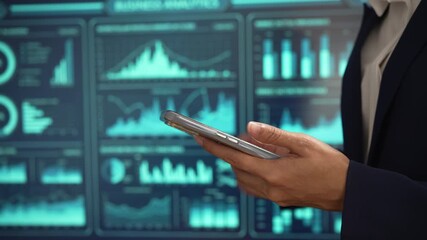 Professional individual woman in navy suit uses smartphone while standing, glowing digital dashboards, data analytics, futuristic interface elements, advanced technology for business intelligence. - Powered by Adobe