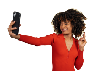 Happy black woman taking selfie pointing finger up