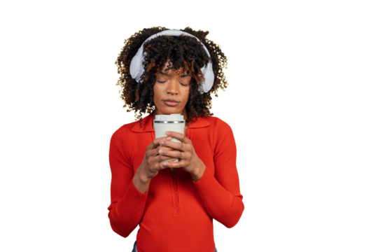 Young woman enjoying coffee and music in headphones - Powered by Adobe