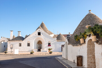 Pictures of Trulli, Italy, showing charming conical-roof houses, cobblestone streets, and historic...