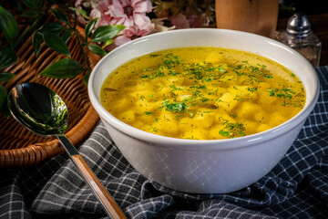 Broth - chicken soup in a bowl.