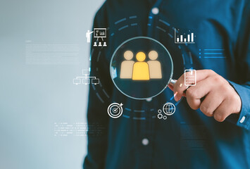 person holding magnifying glass with digital audience icons, symbolizing customer targeting, data analytics, market research, business strategy for identifying ideal users and improving performance.