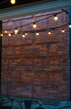 Outdoor cafe patio with evening lights and cozy ambience