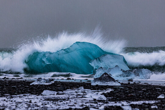 waves crashing on the ice - Powered by Adobe