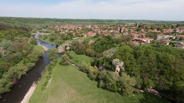 Spring drone video of the Rock Arch &ldquo;The Arch&rdquo; near Ăglen, showing the Slona rock formation, lush greenery, the karst landscape, and the winding Vit River, 2019