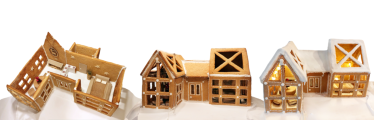 Miniature house model close-up. Decorated gingerbread house. Food art, home warmth, interior design concepts. House building process, stages. Christmas vibes scene. PNG