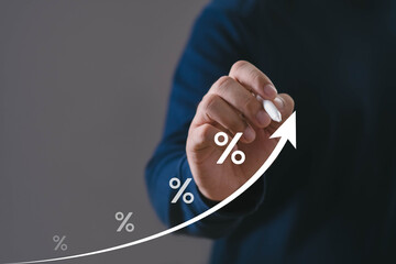 business hand drawing an upward arrow with percentage symbols, illustrating financial growth, interest rate trends, and successful economic performance suitable for investment, banking, and analytics