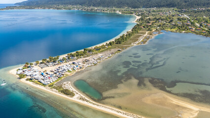 Aerial drone view of Fteroti Beach, sandbanks and lagoon in Sithonia, Chalkidiki, Greece