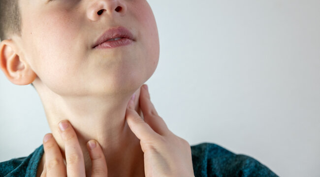 Teen boy holding sore throat, voice loss, painful swallowing, adolescence change, puberty voice transition, struggling to speak, tonsillitis pain