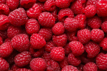 Fresh ripe raspberries as background, top view