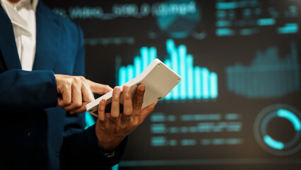 Business professional using digital tablet before futuristic radar-style interface, technology interaction, data processing, cyber analytics, innovation, modern workflow, advanced digital operations