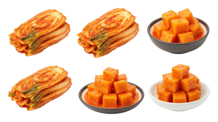 Assorted Korean kimchi varieties featuring napa cabbage kimchi and cubed radish kimchi (kkakdugi) in bowls on a transparent background
