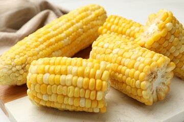 Pieces of boiled corncobs on table, closeup