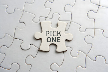 Fototapeta premium A single puzzle piece fitting into a larger puzzle