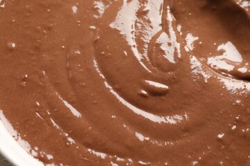Texture of liquid chocolate dough as background, top view