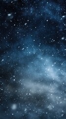 Obraz premium A mesmerizing view of falling snowflakes against a deep blue backdrop, capturing the serene beauty of a winter night.