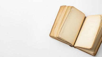 Open vintage book with yellowed pages on white background, evoking nostalgia and curiosity